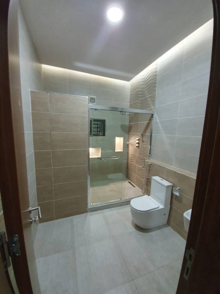 Toilet and shower with sliding door